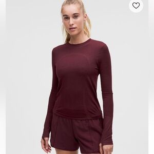 Swiftly tech long sleeve with thumb holes and moisture proof material. Size 10